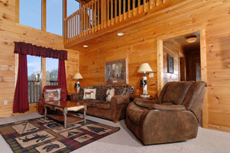 Pigeon Forge Cabin that has a living room area overlooking a beautiful mountain view of downtown Pigeon Forge